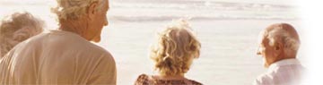 Two older couples on a beach