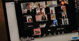 A laptop computer displaying an online meeting