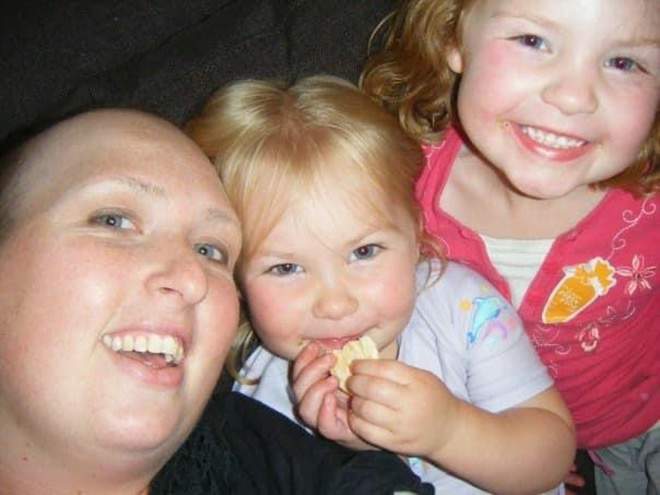 Kate during treatment, pictured with her two daughters Gemma and Bree.