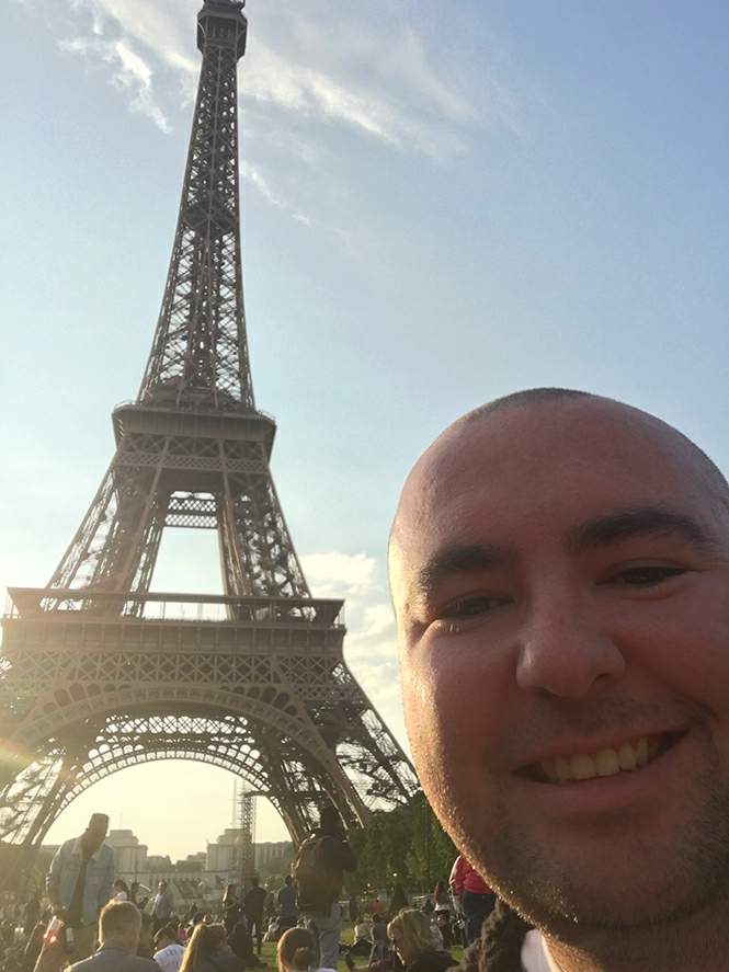 Trent in front of the Eiffel Tower during his celebratory Europe trip.