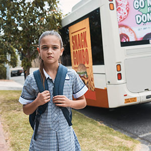 Girl in front of bus