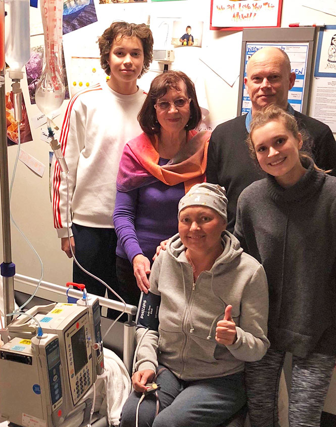 Natasha in hospital with her family