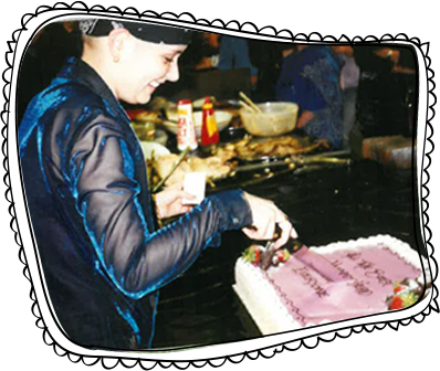 Kelly cutting a cake