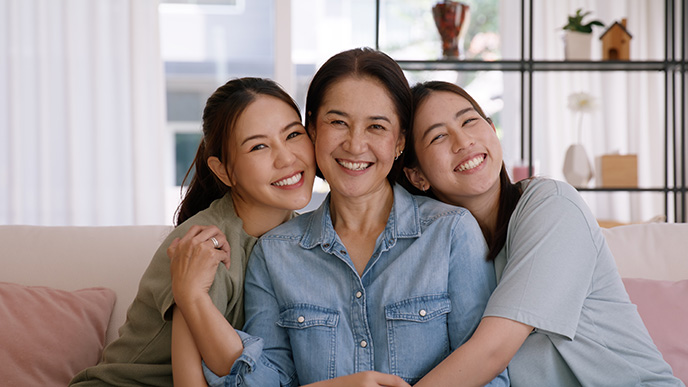 Mother daughter working at dining table