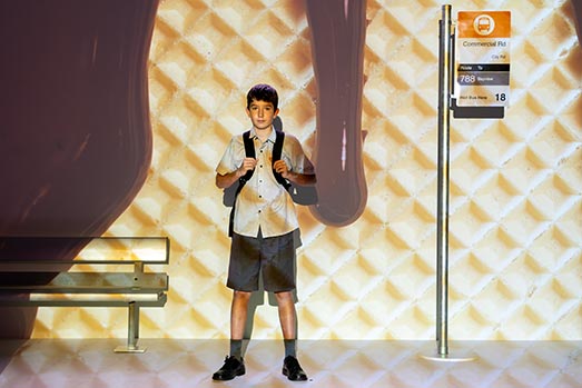 Boy with a projected image of junk food over him