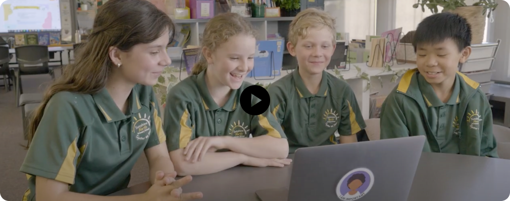 Primary school children learning from a laptop - Watch the video
