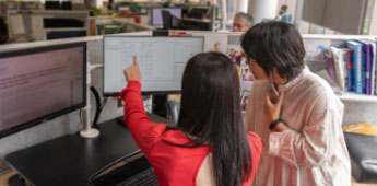 People meeting in front on computer