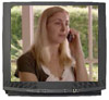 A TV screening a cancer helpline advertisement